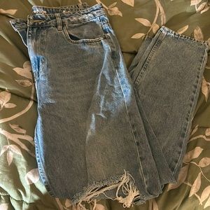 Light ripped blue jeans